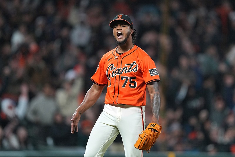 Apr 26, 2024; San Francisco, California, USA; San Francisco Giants pitcher Camilo Doval (75) reacts after a double play to end the top of the ninth inning against the Pittsburgh Pirates at Oracle Park. Mandatory Credit: Darren Yamashita-USA TODAY Sports