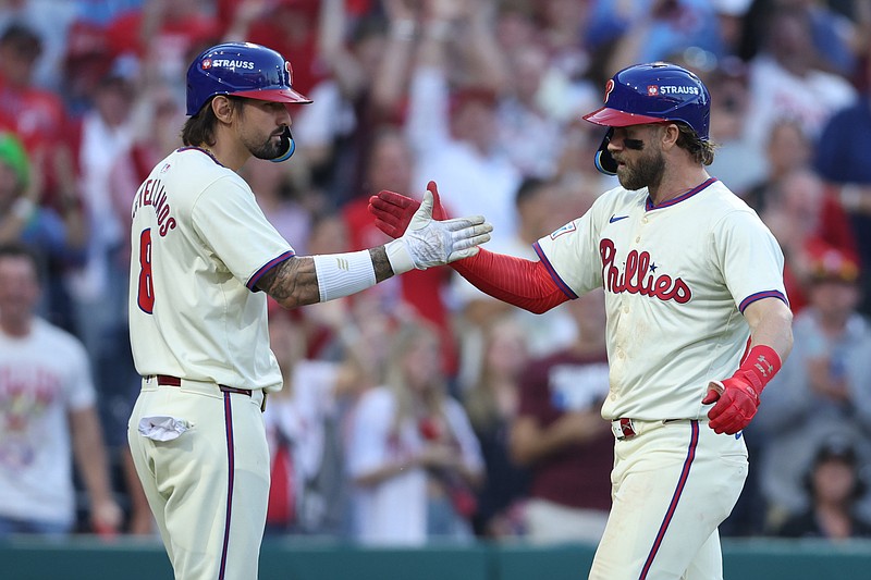 Oct 6, 2024; Philadelphia, Pennsylvania, USA; Philadelphia Phillies outfielder Nick Castellanos (8) congratulates first base Bryce Harper (3) after hitting a home-run in the sixth inning against the New York Mets  during game two of the NLDS for the 2024 MLB Playoffs at Citizens Bank Park. Mandatory Credit: Bill Streicher-Imagn Images