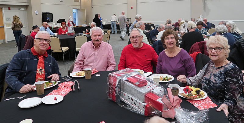 Older adults attend the Village by the Shore holiday social.