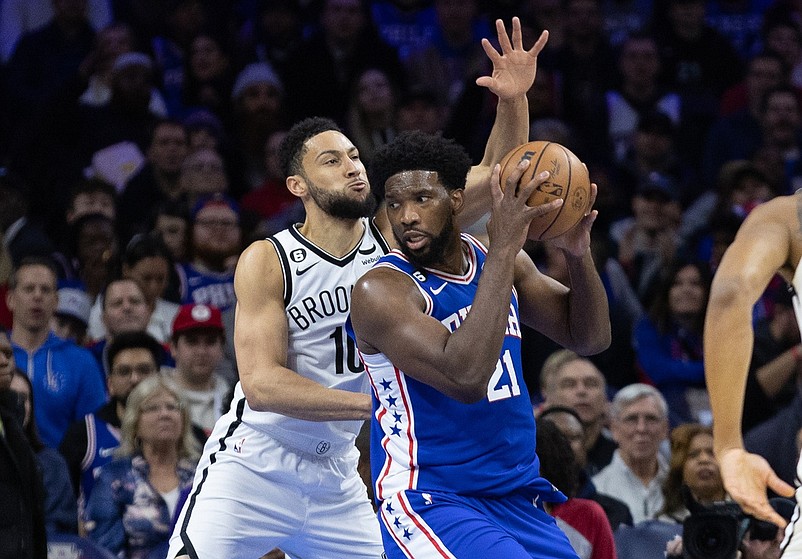 Jan 25, 2023; Philadelphia, Pennsylvania, USA; Philadelphia 76ers center Joel Embiid (21) controls the ball against Brooklyn Nets guard Ben Simmons (10) during the first quarter at Wells Fargo Center. Mandatory Credit: Bill Streicher-USA TODAY Sports