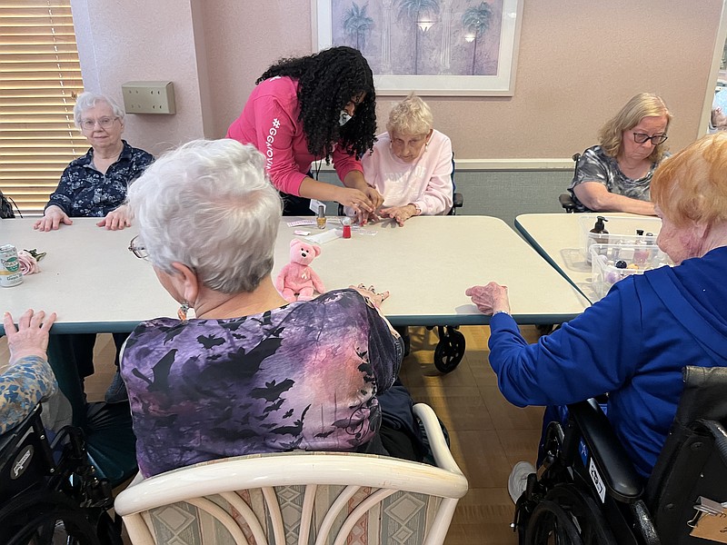 ACIT Cosmetology students give manicures to seniors at Seashore Gardens Living Center.