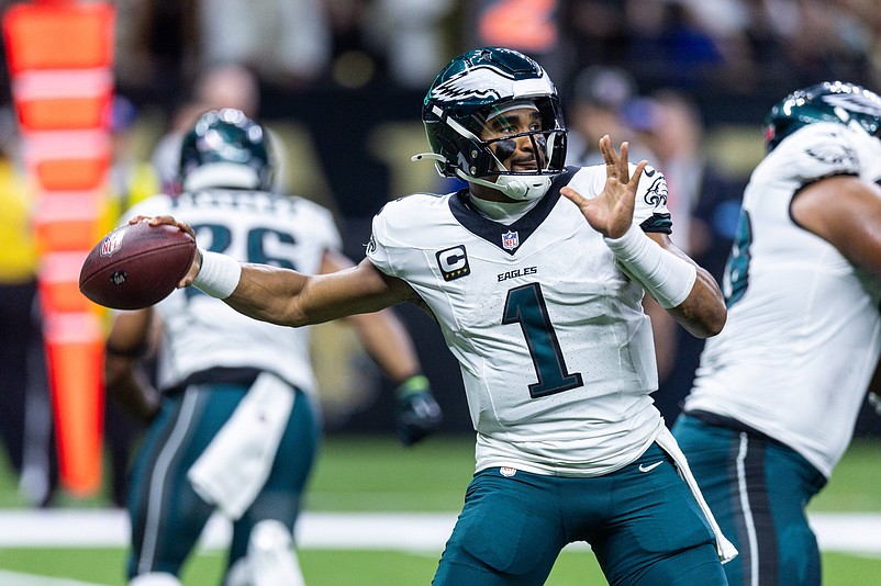 Sep 22, 2024; New Orleans, Louisiana, USA; Philadelphia Eagles quarterback Jalen Hurts (1) passes against the New Orleans Saints during the first half at Caesars Superdome. Mandatory Credit: Stephen Lew-Imagn Images