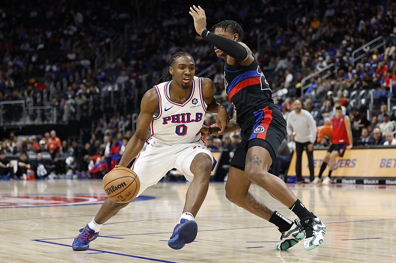 Nov 30, 2024; Detroit, Michigan, USA; Philadelphia 76ers guard Tyrese Maxey (0) dribbles defended by Detroit Pistons guard Marcus Sasser (25) in the first half at Little Caesars Arena. Mandatory Credit: Rick Osentoski-Imagn Images