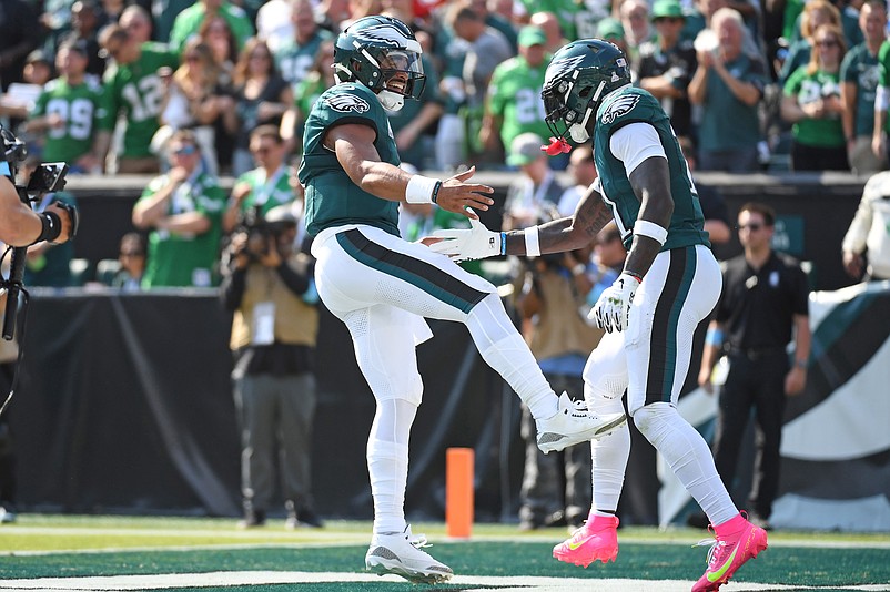 Oct 13, 2024; Philadelphia, Pennsylvania, USA; Philadelphia Eagles quarterback Jalen Hurts (1) and wide receiver A.J. Brown (11) celebrate touchdown against the Cleveland Browns during the second quarter at Lincoln Financial Field. Mandatory Credit: Eric Hartline-Imagn Images