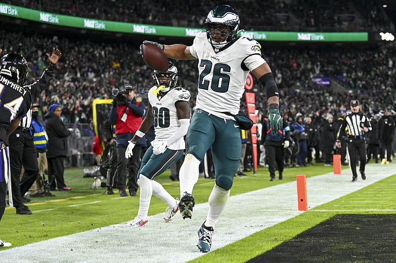 Dec 1, 2024; Baltimore, Maryland, USA;Philadelphia Eagles running back Saquon Barkley (26) celebrates scoring a touchdown   during the second  half  against the Baltimore Ravens at M&T Bank Stadium. Mandatory Credit: Tommy Gilligan-Imagn Images