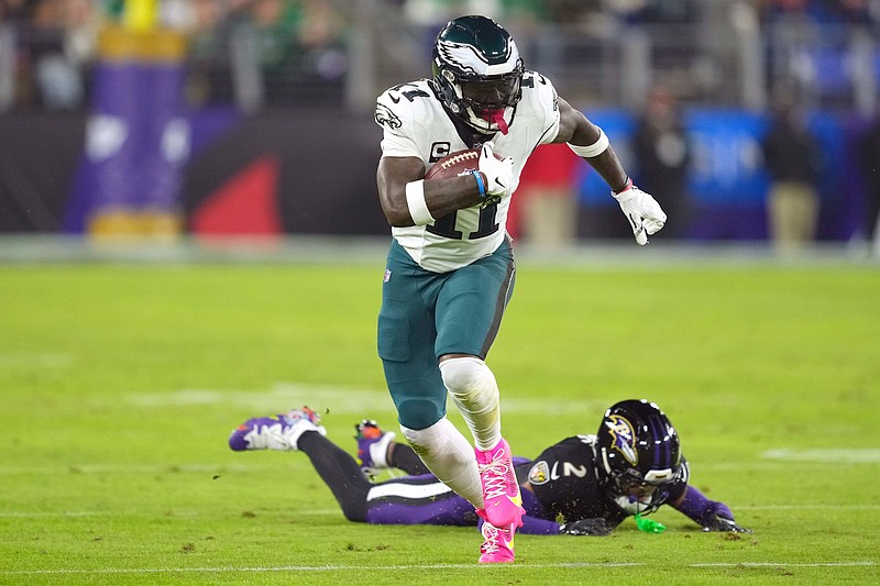 Dec 1, 2024; Baltimore, Maryland, USA; Philadelphia Eagles wide receiver A.J. Brown (11) gains yardage after a third quarter catch defended by Baltimore Ravens cornerback Nate Wiggins (2) at M&T Bank Stadium. Mandatory Credit: Mitch Stringer-Imagn Images