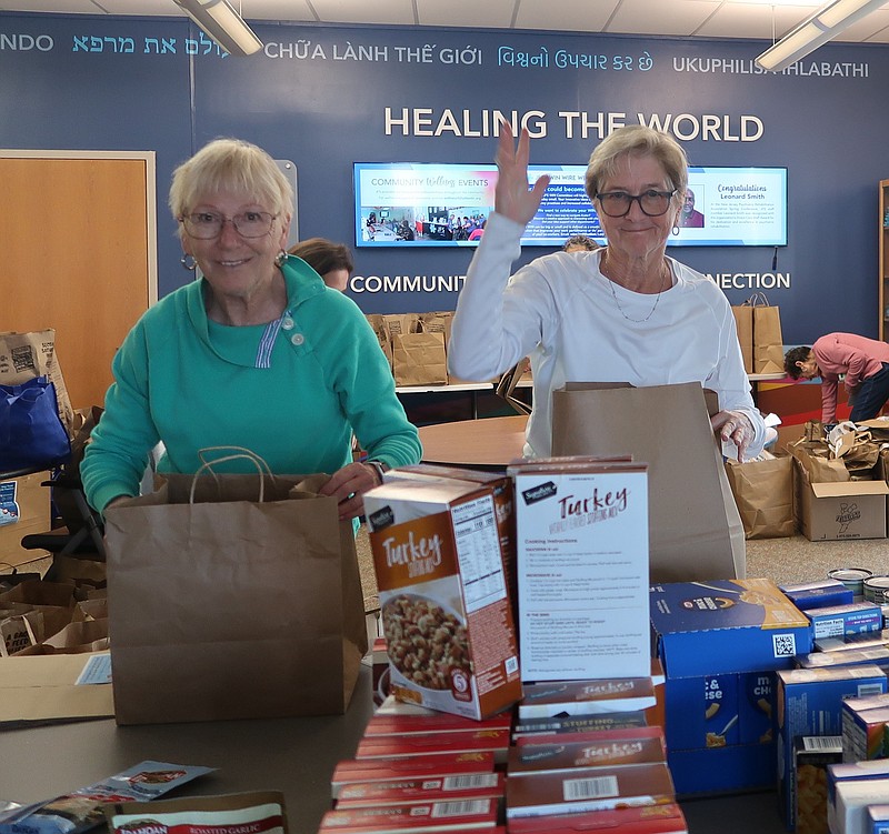 Volunteers Carol Beckmann and Vera Frumin helped prepare Thanksgiving meal bags for community residents. (Photo courtesy of Jewish Family Services of Atlantic and Cape May counties)