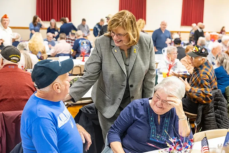 Pennycuick chats with veterans and their families at her second annual Veterans Appreciation breakfast. (Credit: Julie Neal)