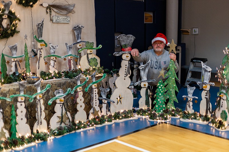 A crafter with his booth at a previous Winter Craft Fair. (Credit: Montgomery Township)