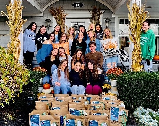 JFS/Mainland High School cheerleaders collected 25 bags of Thanksgiving favorites to support the JFS Turkey Drive.