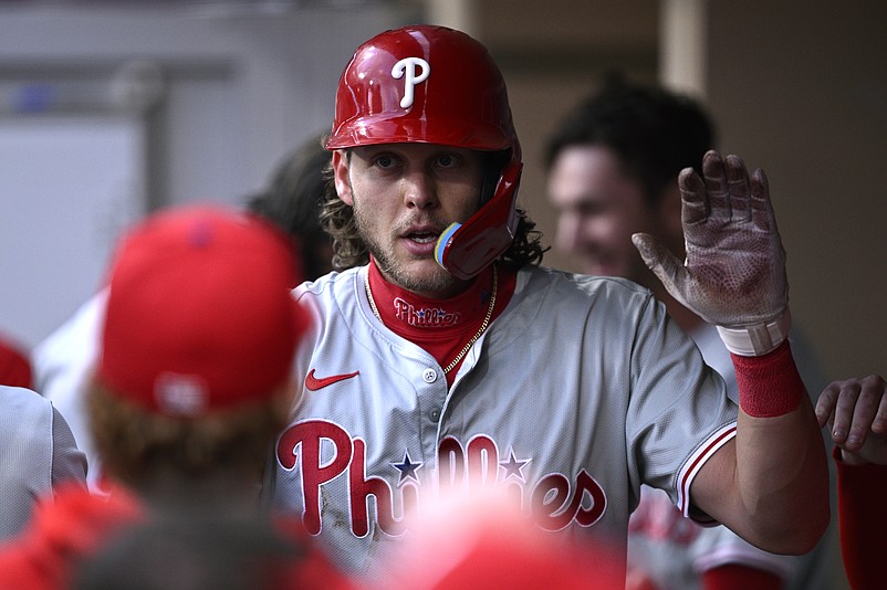 Apr 26, 2024; San Diego, California, USA; Philadelphia Phillies third baseman Alec Bohm (28) is congratulated in the dugout after scoring a run against the San Diego Padres during the first inning at Petco Park. Mandatory Credit: Orlando Ramirez-USA TODAY Sports