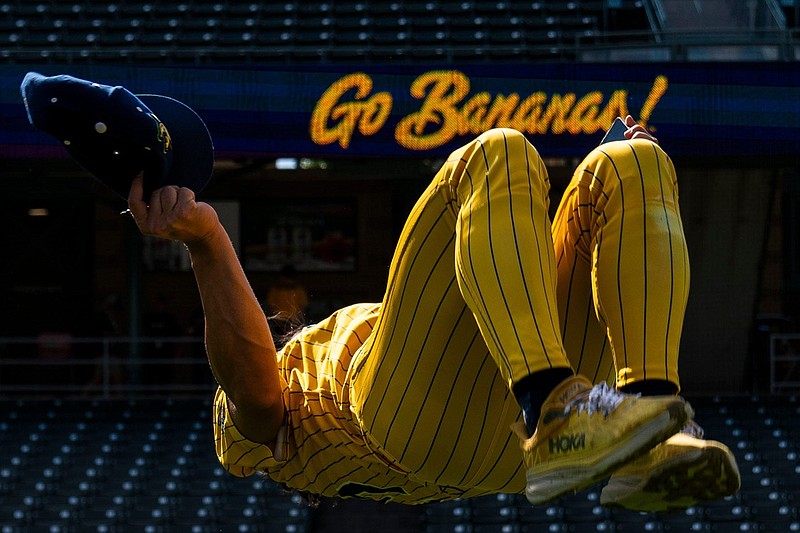 Savannah Bananas infielder Robert Anthony Cruz (15) does a backflip Thursday, June 27, 2024, during a Savannah Bananas World Tour show at Victory Field in Indianapolis.