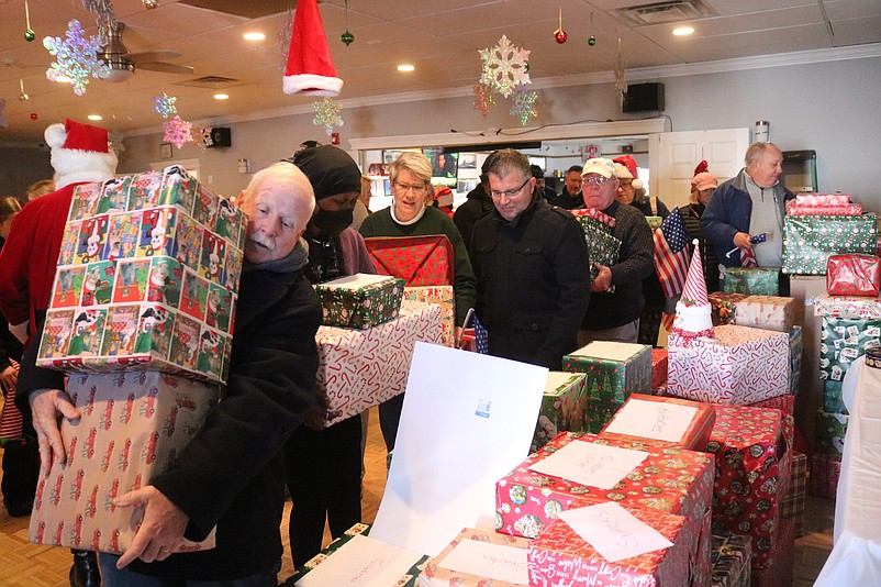 Colorfully wrapped gifts bound for the Veterans Memorial Home fill the table inside the VFW Post 1963 headquarters in Sea Isle City.