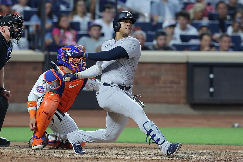 Jun 25, 2024; New York City, New York, USA; New York Yankees right fielder Juan Soto (22) follows through on a solo home run against the New York Mets during the fifth inning at Citi Field. Mandatory Credit: Brad Penner-USA TODAY Sports