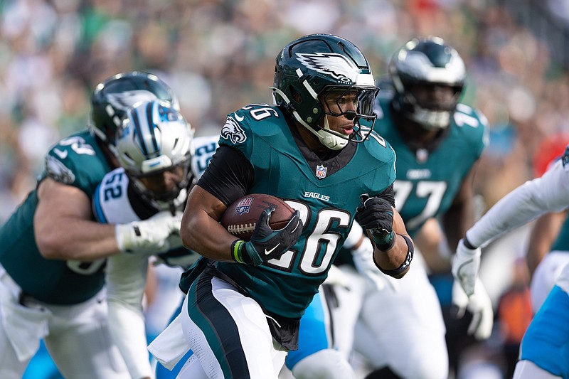 Dec 8, 2024; Philadelphia, Pennsylvania, USA;  Philadelphia Eagles running back Saquon Barkley (26) runs with the ball against the Carolina Panthers during the first quarter at Lincoln Financial Field. Mandatory Credit: Bill Streicher-Imagn Images