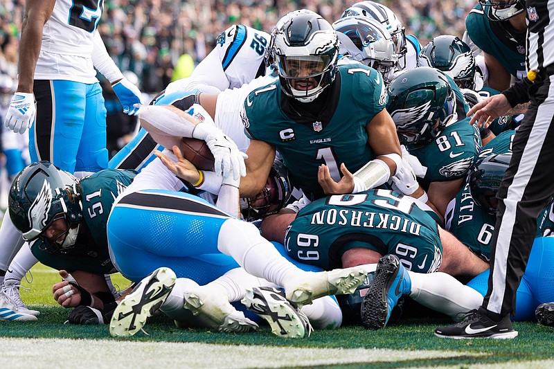 Dec 8, 2024; Philadelphia, Pennsylvania, USA;  Philadelphia Eagles quarterback Jalen Hurts (1) reacts after scoring against the Carolina Panthers during the second quarter at Lincoln Financial Field. Mandatory Credit: Bill Streicher-Imagn Images