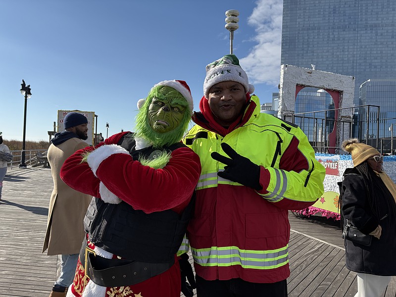 Mayor Marty Small poses with the Grinch.