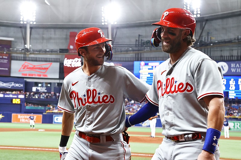 Jul 5, 2023; St. Petersburg, Florida, USA;  Philadelphia Phillies shortstop Trea Turner (7) is congratulated  by  designated hitter Bryce Harper (3) after scoring against the Tampa Bay Rays during the fifth inning at Tropicana Field. Mandatory Credit: Kim Klement-USA TODAY Sports