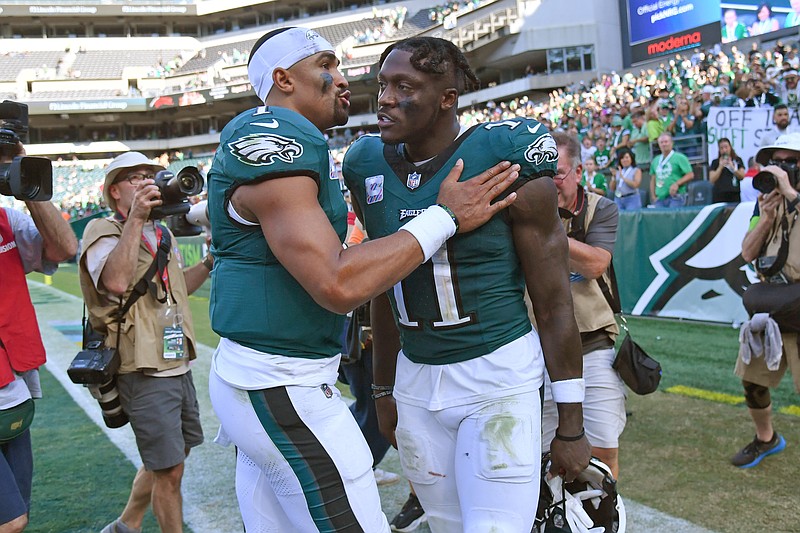 Oct 1, 2023; Philadelphia, Pennsylvania, USA; Philadelphia Eagles quarterback Jalen Hurts (1) and wide receiver A.J. Brown (11) walk off the field against the Washington Commanders at Lincoln Financial Field. Mandatory Credit: Eric Hartline-USA TODAY Sports