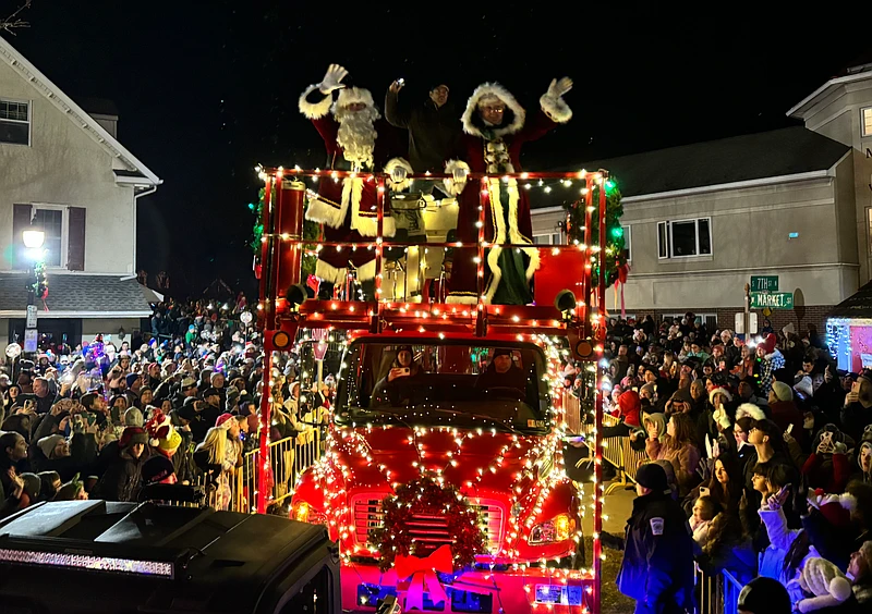 Santa and Mrs. Claus arrive on a Perkasie Electric Truck to light the Christmas tree.