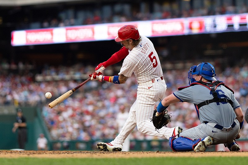 Jul 9, 2024; Philadelphia, Pennsylvania, USA; Philadelphia Phillies second base Bryson Stott (5) hits a home run during the fourth inning against the Los Angeles Dodgers at Citizens Bank Park. Mandatory Credit: Bill Streicher-USA TODAY Sports