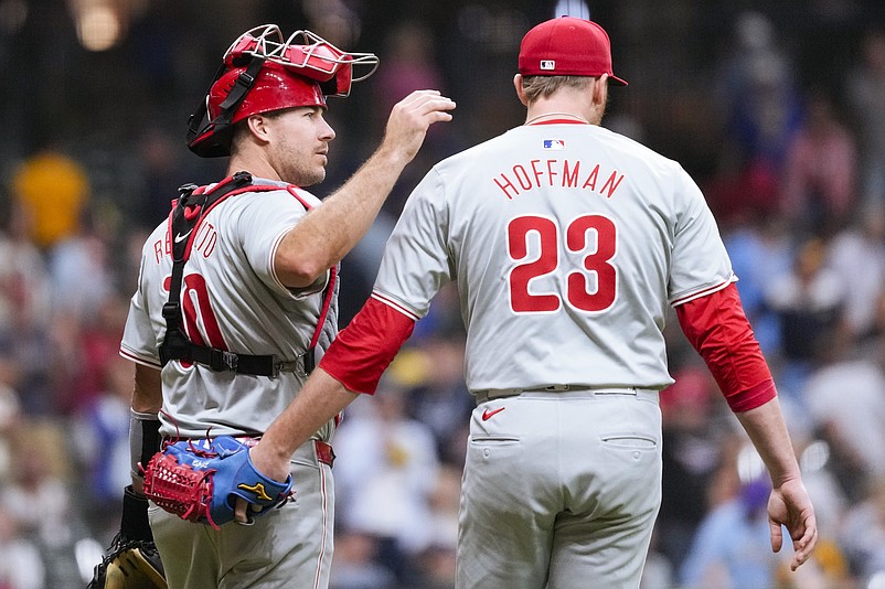 Sep 17, 2024; Milwaukee, Wisconsin, USA;  Philadelphia Phillies catcher J.T. Realmuto (10) greets pitcher Jeff Hoffman (23) following the game against the Milwaukee Brewers at American Family Field. Mandatory Credit: Jeff Hanisch-Imagn Images