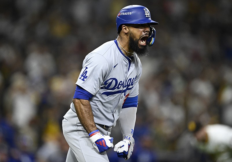 Oct 8, 2024; San Diego, California, USA; Los Angeles Dodgers outfielder Teoscar Hernandez (37) celebrates after hitting a grand slam in the third inning against the San Diego Padres during game three of the NLDS for the 2024 MLB Playoffs at Petco Park.  Mandatory Credit: Denis Poroy-Imagn Images