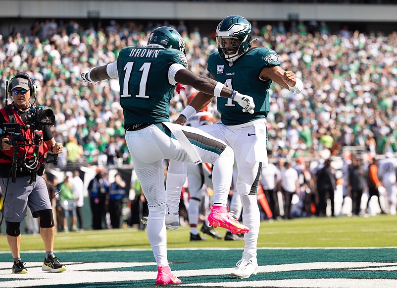 Oct 13, 2024; Philadelphia, Pennsylvania, USA; Philadelphia Eagles quarterback Jalen Hurts (1) and wide receiver A.J. Brown (11) celebrate their touchdown pass during the second quarter against the Cleveland Browns at Lincoln Financial Field. Mandatory Credit: Bill Streicher-Imagn Images