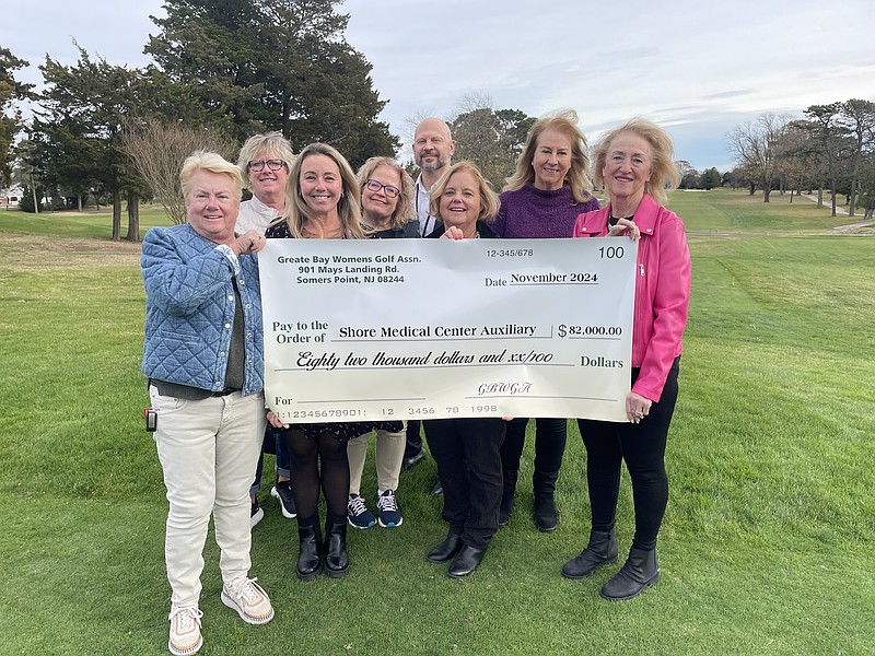 Provided/The Greate Bay Women's Golf Association presented a check for $82,000 to representatives of Shore Medical Center and Shore Cancer Center Auxiliary Nov. 27. From left, Pat Cowan, Janet Schiltz, Jessica Giles, Calla Waldron-Buck, Matt Piskun, Brenda Martello, Elizabeth Mead and Jane Davis.