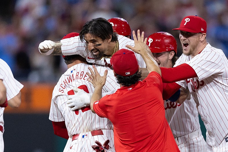 Jun 18, 2024; Philadelphia, Pennsylvania, USA; Philadelphia Phillies outfielder Nick Castellanos (8) celebrates with his team after hitting a game winning RBI double during the ninth inning against the San Diego Padres at Citizens Bank Park. Mandatory Credit: Bill Streicher-USA TODAY Sports
