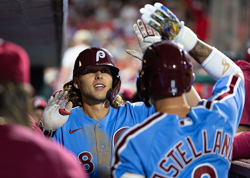 Sep 21, 2023; Philadelphia, Pennsylvania, USA; Philadelphia Phillies first baseman Alec Bohm (28) celebrates in the dugout with right fielder Nick Castellanos (8) after hitting a home run during the third inning New York Mets at Citizens Bank Park. Mandatory Credit: Bill Streicher-USA TODAY Sports