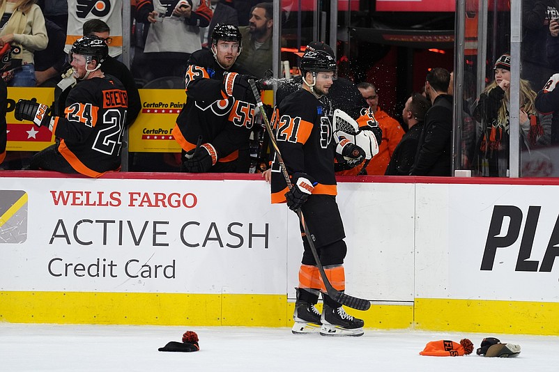 Dec 12, 2024; Philadelphia, Pennsylvania, USA; Philadelphia Flyers defenseman Rasmus Ristolainen (55) sprays center Scott Laughton (21) after he scored a hat-trick goal against the Detroit Red Wings in the third period at Wells Fargo Center. Mandatory Credit: Kyle Ross-Imagn Images