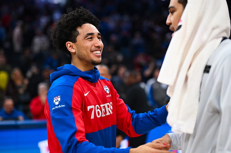 Dec 6, 2024; Philadelphia, Pennsylvania, USA; Philadelphia 76ers guard Jared McCain (20) reacts with Orlando Magic guard Anthony Black (0) after the game at Wells Fargo Center. Mandatory Credit: Kyle Ross-Imagn Images