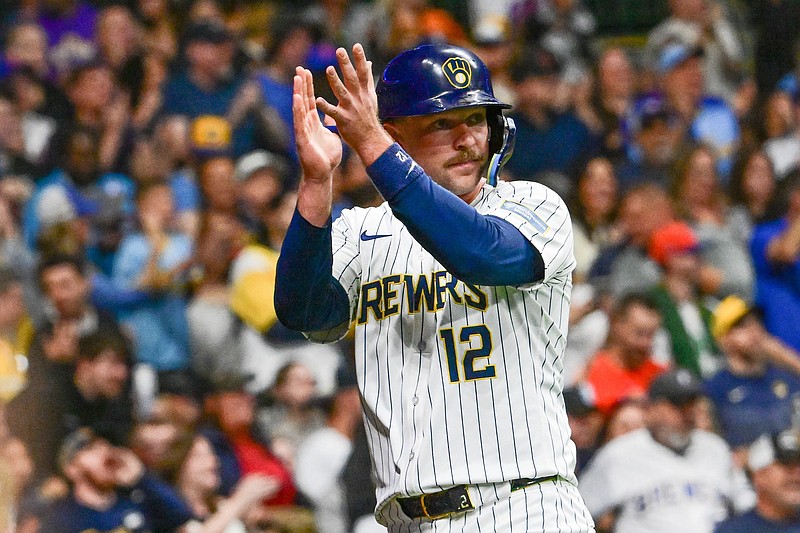 Sep 28, 2024; Milwaukee, Wisconsin, USA; Milwaukee Brewers first baseman Rhys Hoskins (12) reacts after scoring a run in the fourth inning against the New York Mets at American Family Field. Mandatory Credit: Benny Sieu-Imagn Images