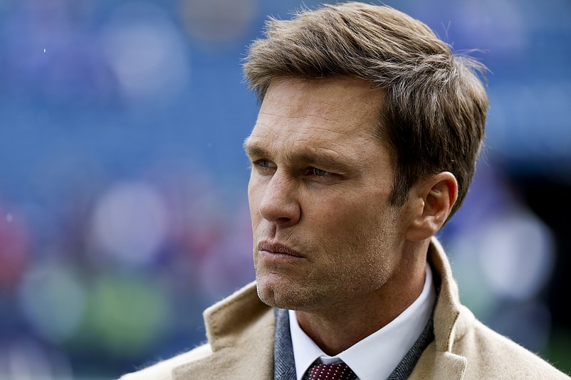 Oct 27, 2024; Seattle, Washington, USA; FOX commentator Tom Brady stands on the sideline before a game between the Seattle Seahawks and Buffalo Bills at Lumen Field. Mandatory Credit: Joe Nicholson-Imagn Images