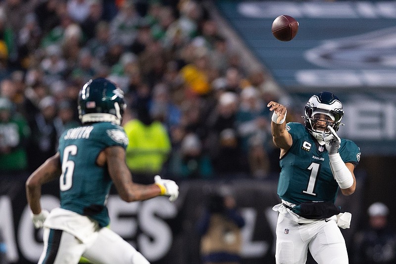 Dec 15, 2024; Philadelphia, Pennsylvania, USA; Philadelphia Eagles quarterback Jalen Hurts (1) passes to wide receiver DeVonta Smith (6) during the first quarter against the Pittsburgh Steelers at Lincoln Financial Field. Mandatory Credit: Bill Streicher-Imagn Images