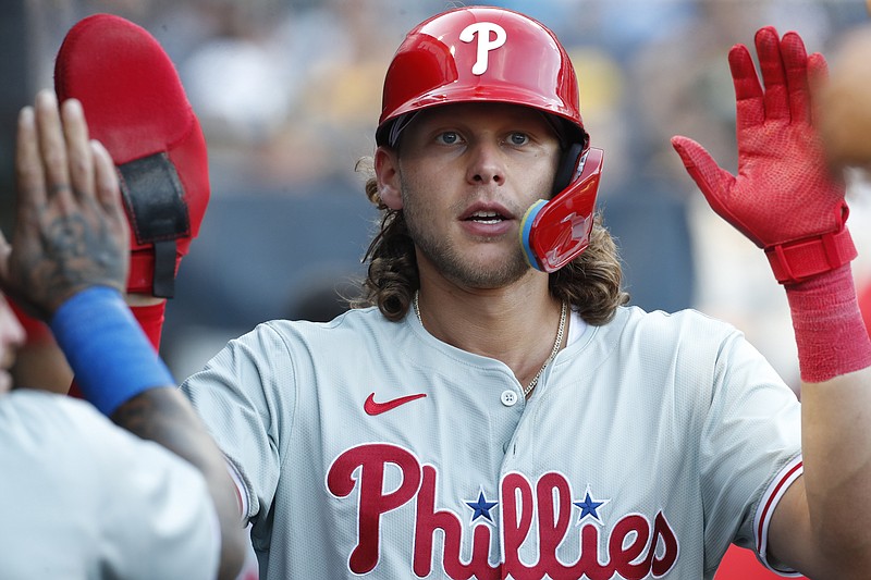 Jul 19, 2024; Pittsburgh, Pennsylvania, USA;  Philadelphia Phillies third baseman Alec Bohm (28) high-fives in the dugout after scoring a run against the Pittsburgh Pirates during the first inning at PNC Park. Mandatory Credit: Charles LeClaire-USA TODAY Sports