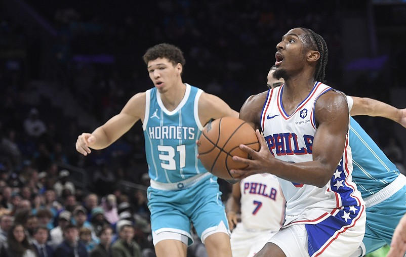 Dec 16, 2024; Charlotte, North Carolina, USA; Philadelphia 76ers guard Tyrese Maxey (0) drives in during the first half against the Charlotte Hornets at the Spectrum Center. Mandatory Credit: Sam Sharpe-Imagn Images