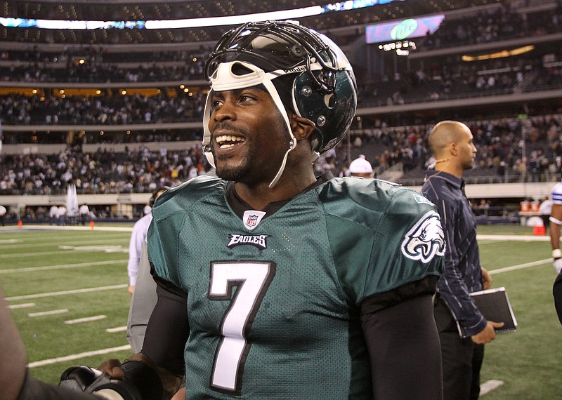 Dec 12, 2010; Arlington, TX, USA; Philadelphia Eagles quarterback Michael Vick (7) smiles after the game against the Dallas Cowboys at Cowboys Stadium. The Eagles beat the Cowboys 30-27. Mandatory Credit: Matthew Emmons-USA TODAY Sports