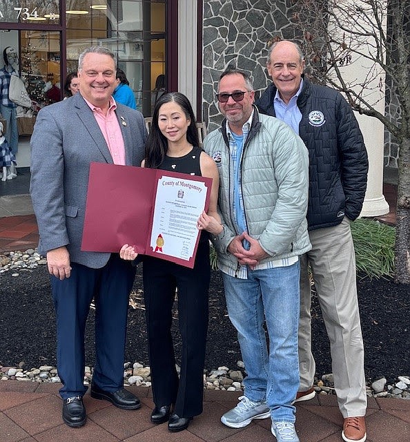 From left to right are Montgomery County Commissioner Thomas DiBello, MiAmore Pets owner Sara Choi, Whitpain Supervisor Jeff Campolongo, and Whitpain Board Chair Scott Badami, all welcoming a new business to the township. (Image courtesy of Whitpain Township)