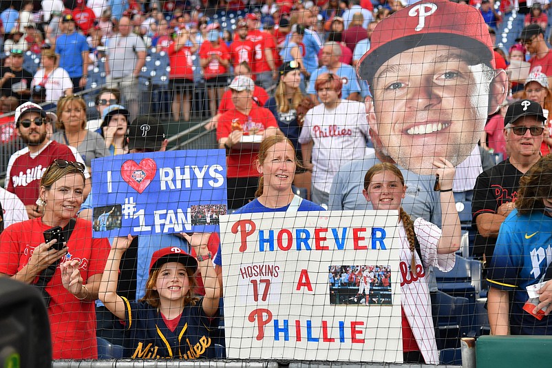 Jun 3, 2024; Philadelphia, Pennsylvania, USA; Fans hold signs for Milwaukee Brewers first base Rhys Hoskins (12) making his return against the Philadelphia Phillies at Citizens Bank Park. Mandatory Credit: Eric Hartline-USA TODAY Sports