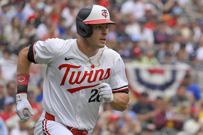 May 25, 2024; Minneapolis, Minnesota, USA;  Minnesota Twins outfielder Max Kepler (26) heads to first on a single against the Texas Rangers during the eighth inning at Target Field. Mandatory Credit: Nick Wosika-USA TODAY Sports