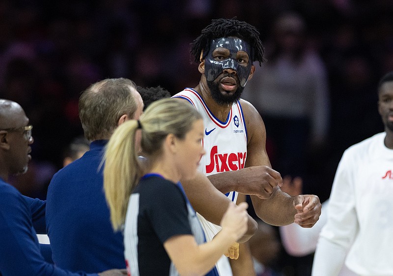 Dec 23, 2024; Philadelphia, Pennsylvania, USA; Philadelphia 76ers center Joel Embiid (21) argues with referee Jenna Schroeder (20) and is ejected on a second technical foul during the second quarter against the San Antonio Spurs at Wells Fargo Center. Mandatory Credit: Bill Streicher-Imagn Images