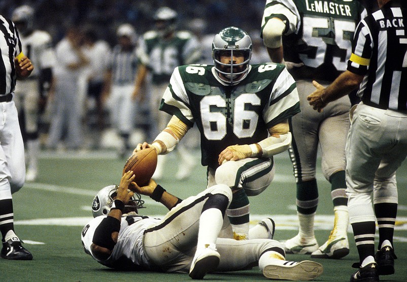 Jan 25, 1981; New Orleans, LA, USA; FILE PHOTO; Philadelphia Eagles linebacker Bill Bergey (66) kneels over Oakland Raiders tight end Raymond Chester (88) in Super Bowl XV at the Superdome. The Raiders defeated the Eagles 27-10. Mandatory Credit: Manny Rubio-USA TODAY Sports