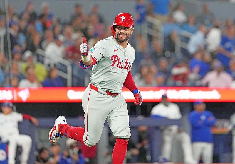 Sep 3, 2024; Toronto, Ontario, CAN; Philadelphia Phillies designated hitter Kyle Schwarber (12) gives the thumbs up sign after hitting a three-run home run against the Toronto Blue Jays during the ninth inning at Rogers Centre. Mandatory Credit: Nick Turchiaro-Imagn Images