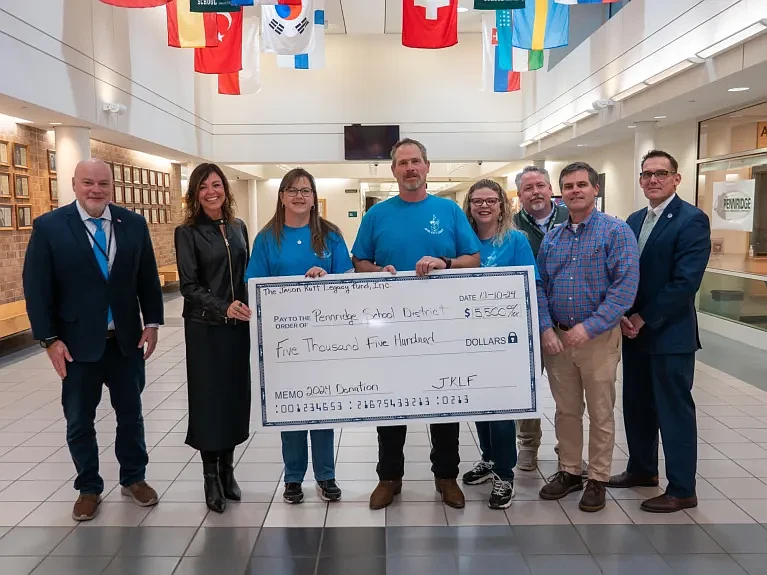 From L-R: Superintendent Angelo Berrios III, Pennridge Social Worker Dawn Hoopes, Jason’s Aunt Patricia Kutt, Jason’s Father Ron Kutt, Jason’s Mother Dana Kutt, Assistant Superintendent Dr. Bradley Palmer, Pennridge Social Worker Joe Werner, and PHS Principal Tim Keddie. (Credit: David Thomas)