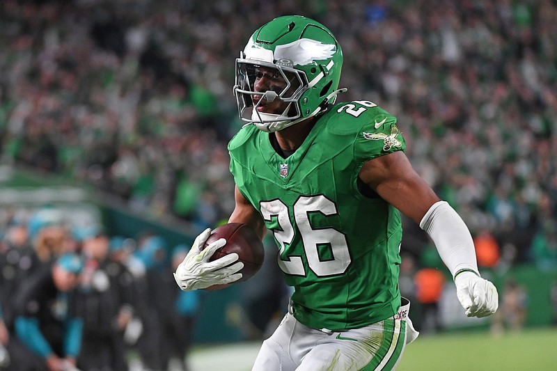 Nov 3, 2024; Philadelphia, Pennsylvania, USA; Philadelphia Eagles running back Saquon Barkley (26) score on a 19-yard touchdown run during the second quarter against the Jacksonville Jaguars at Lincoln Financial Field. Mandatory Credit: Eric Hartline-Imagn Images