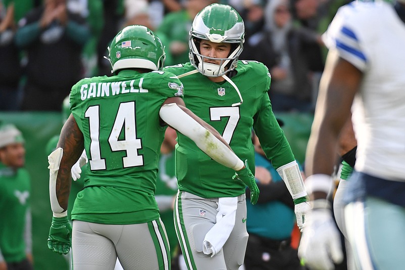 Dec 29, 2024; Philadelphia, Pennsylvania, USA; Philadelphia Eagles quarterback Kenny Pickett (7) celebrates a long pass with running back Kenneth Gainwell (14) against the Dallas Cowboys during the second quarter at Lincoln Financial Field. Mandatory Credit: Eric Hartline-Imagn Images