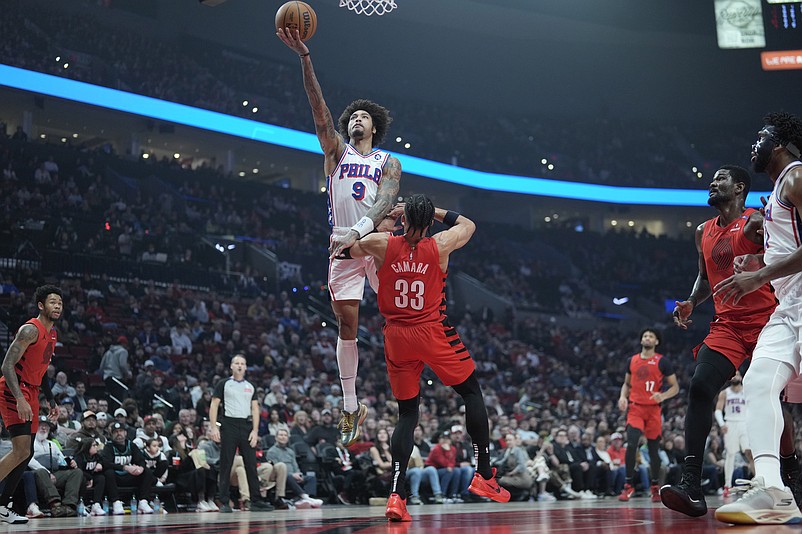 Dec 30, 2024; Portland, Oregon, USA; Philadelphia 76ers shooting guard Kelly Oubre Jr. (9) shoots the ball against Portland Trail Blazers forward Toumani Camara (33) during the first half at Moda Center. Mandatory Credit: Soobum Im-Imagn Images