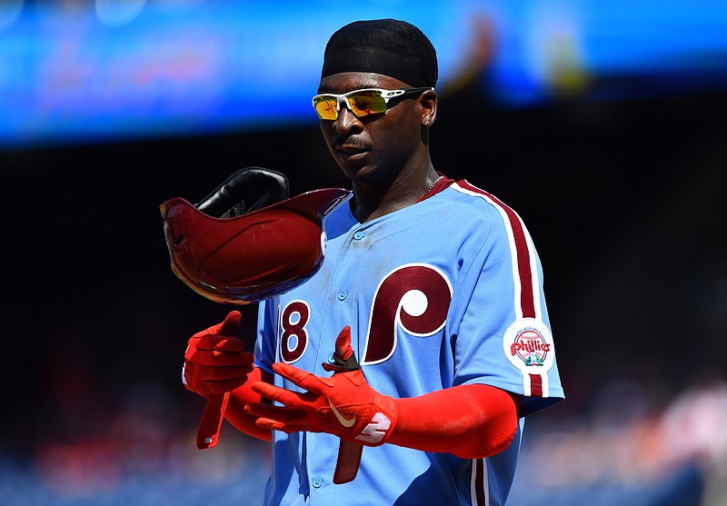 Aug 12, 2021; Philadelphia, Pennsylvania, USA; Philadelphia Phillies shortstop Didi Gregorius (18) tosses his helmet in the sixth inning against the Los Angeles Dodgers at Citizens Bank Park. Mandatory Credit: Kyle Ross-USA TODAY Sports